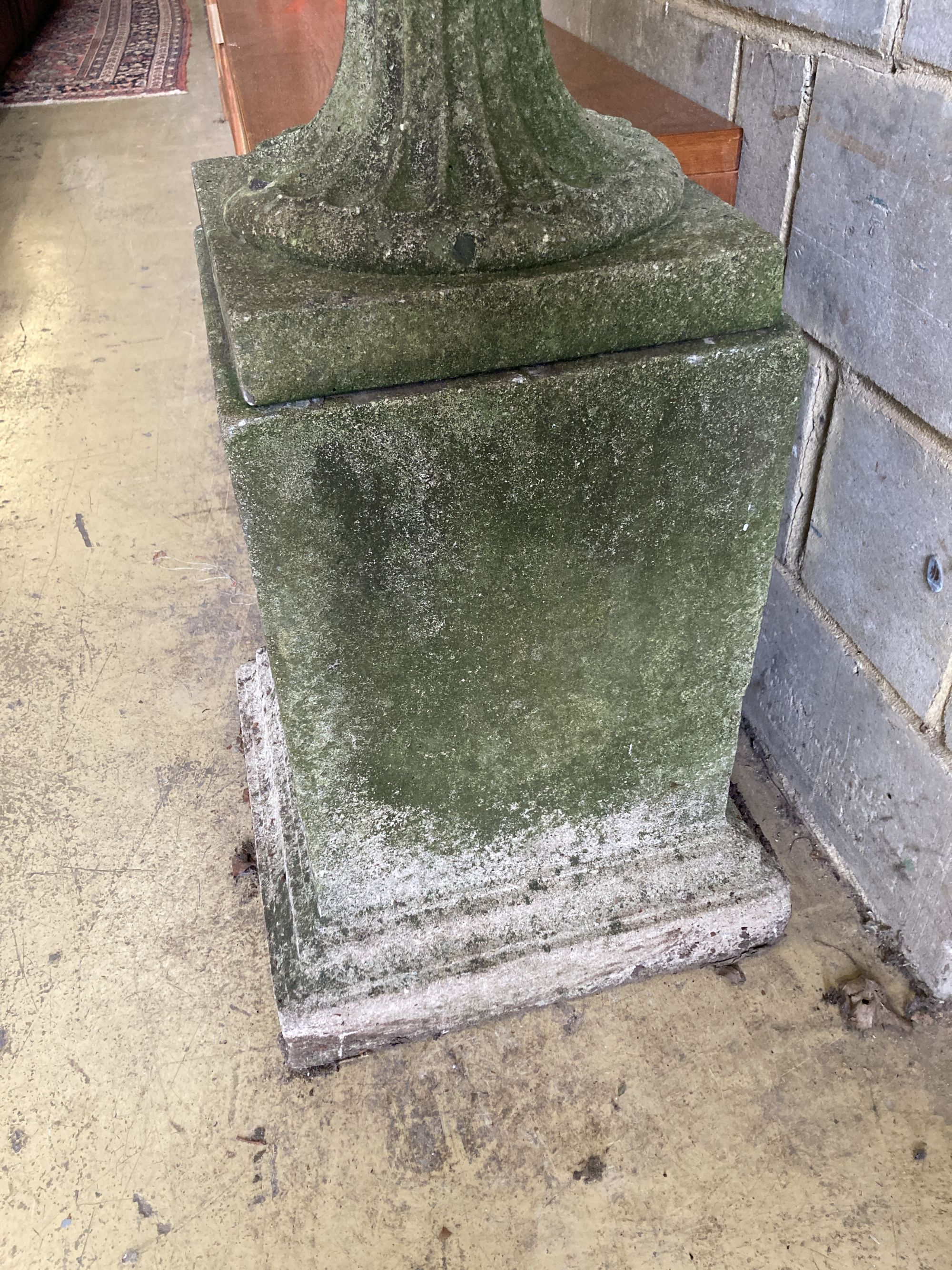 A reconstituted stone campana garden urn on pedestal, diameter 58cm, height 107cm